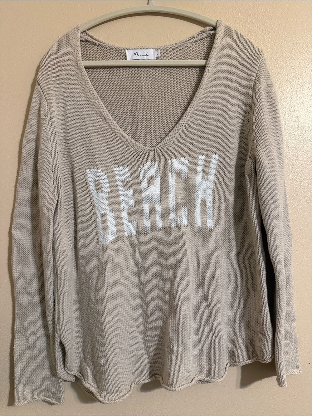 Miracle V-Neck Beach Sweater in Beige with White Lettering